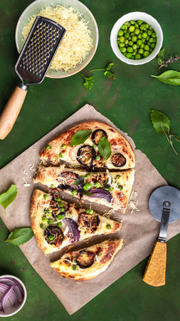 Cheese vegetable tortillas with eggplant, peas, red onion and mozzarella on a green background, top viewの写真素材