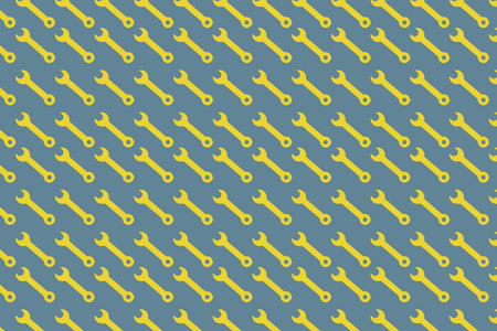 Seamless pattern of yellow and blue wrenches on a blue backgroundのイラスト素材