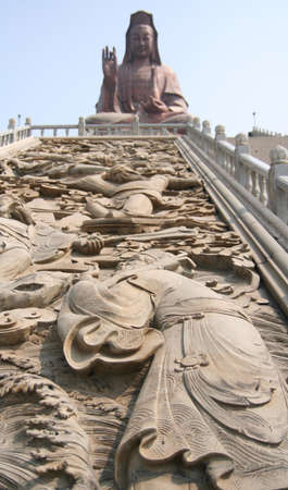 Stories in Chinese history was made in stucco in front of Kuan Yin の写真素材