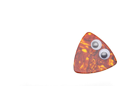 guitar pick, eyeball, look around restlesslyの写真素材