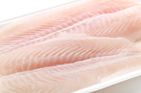 Fillet of Fish Pangasius. Isolated on white background.の写真素材