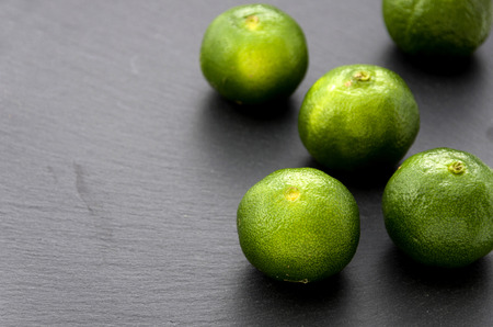 Flat lemon, Citrus depressa Thin-skinned flat lemon, Hirami lemon on treeの写真素材