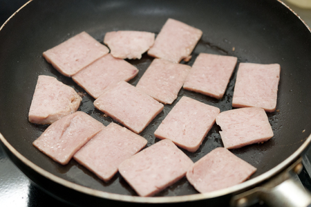 Stir-fry the luncheon meat in a frying panの写真素材
