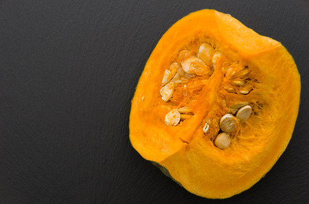 fresh sliced pumpkin (kabocha squash) in bamboo sieveの写真素材