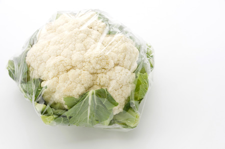 Fresh cauliflower in plastic bagの写真素材