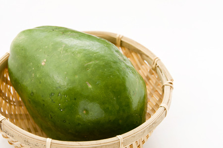 Green Papaya on a bamboo sieve.の写真素材