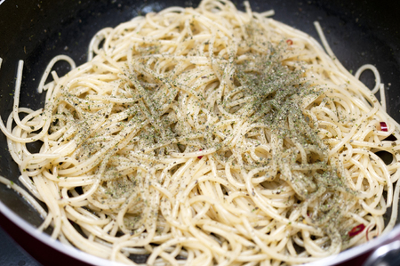 homemade pasta in a frying panの写真素材