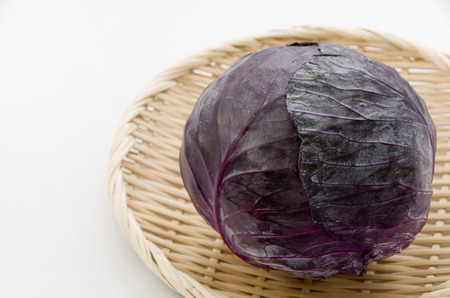 purple cabbage on bamboo sieve.の写真素材
