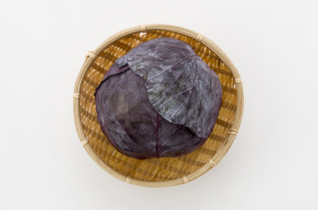 purple cabbage on bamboo sieve.の写真素材