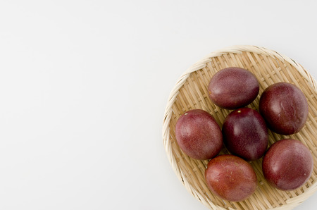 Passion fruit on bamboo sieveの写真素材
