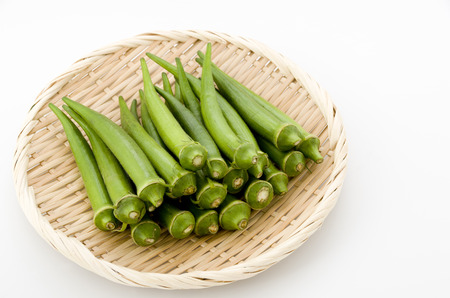 fresh okra on bamboo sieveの写真素材