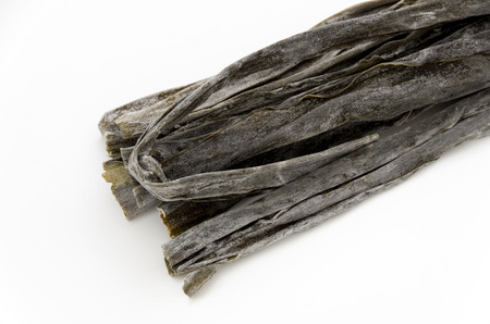 Dried kombu seaweed Japanese dry kelp isolated on white background