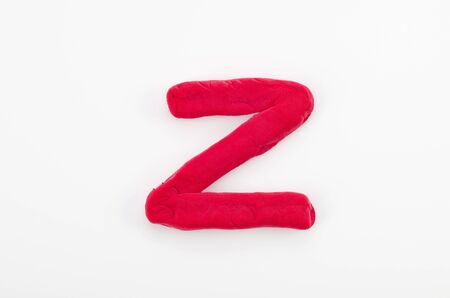 Red plasticine letter Z uppercase of English alphabet isolated on white backgroundの写真素材
