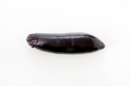 Raw black eggplant isolated white backgroundの写真素材