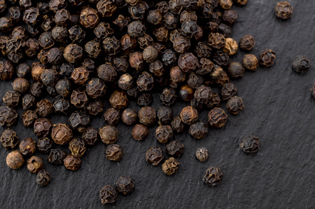 black pepper on black stone plate