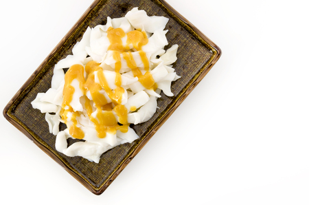 vinegared miso on Boiled squid on plate on white backgroundの写真素材
