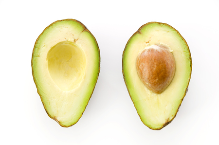 Ripe organic avocados half with seed on white background.の写真素材