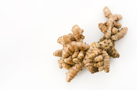 Wild Turmeric (Curcuma aromatica salisb) on bamboo colander on white backgroundの写真素材