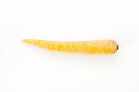 shimaninjin, a type of yellow carrot grown in Okinawa, yellow carrot on white backgroundの写真素材