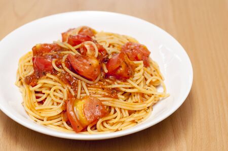 Pasta with fresh tomatoes and meat sauceの写真素材