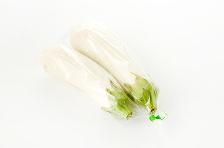 White eggplant in Plastic bag on white backgroundの写真素材