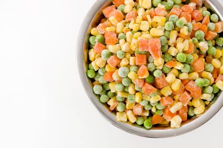 frozen mixed vegetable in stainless steel bowl on white backgroundの写真素材