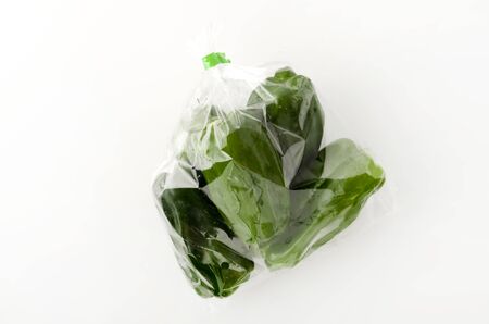 bell pepper in plastic bag on white backgroundの写真素材