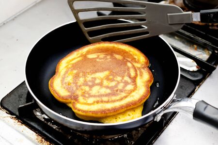 Baking pancake pumpkins in kitchen. Steps of cooking cooking pancakeの写真素材