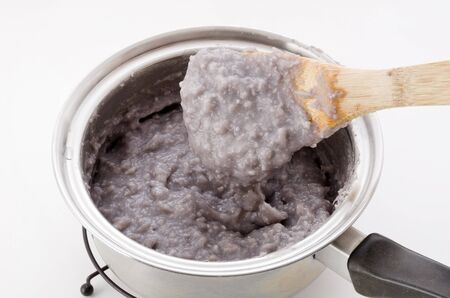 Japanese food, Okinawa cuisine, Ta-nmu(Taimo) ringaku, Boil the Taimo and peel it, it, add sugar and knead.の写真素材