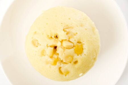 corn steamed cake on white plate on white backgroundの写真素材