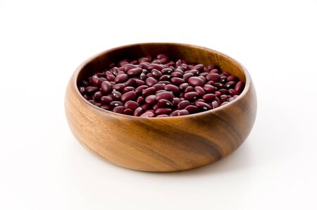 fresh red kidney beans in a round wooden bowlの写真素材