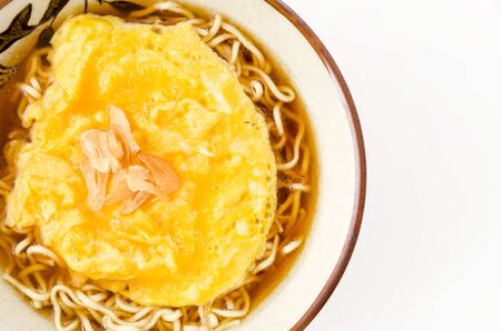 Instant noodles with omelet in bowlの写真素材