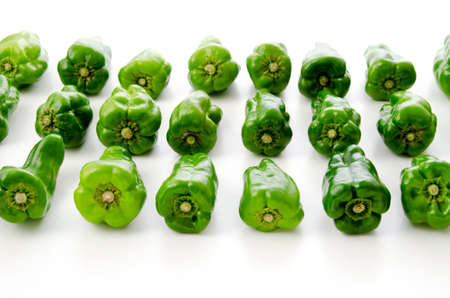 Deformed bell peppers on a white backgroundの写真素材