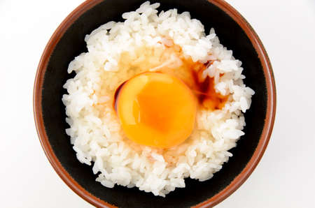Raw egg on white rice, Japanese foodの写真素材