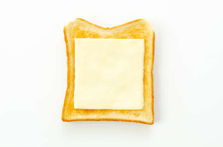 slices of cheese on toast isolated on white backgroundの写真素材