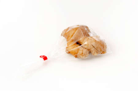 fresh ginger in plastic bag on white backgroundの写真素材
