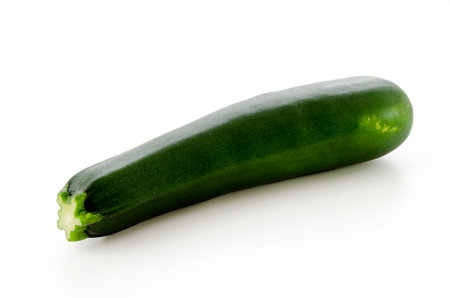 fresh raw zucchini on a white backgroundの写真素材