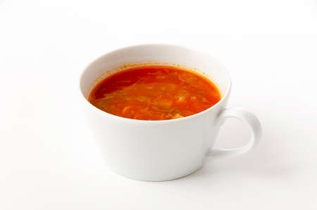 Minestrone soup in the cup on white backgroundの写真素材