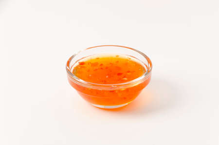 Sweet chili sauce on white background.の写真素材