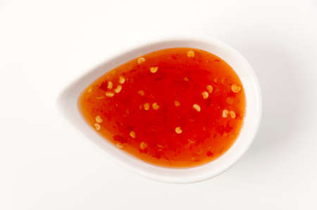 Sweet chili sauce on white backgroundの写真素材