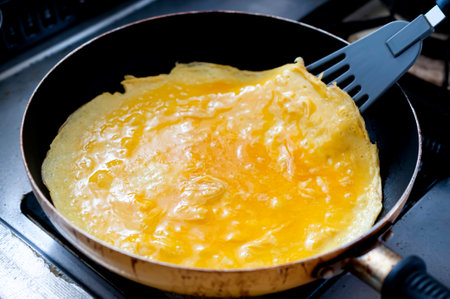 Egg Omelette Cooking in a Frying Panの写真素材