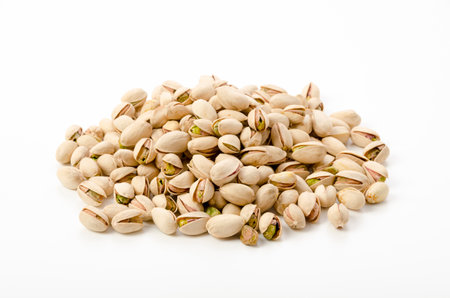 Pistachio nuts on a white backgroundの写真素材