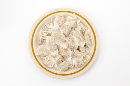 delicious boiled gyoza dumplings on plateの写真素材