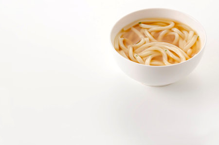 Japanese Kake udon noodles in a bowl on white backgroundの写真素材