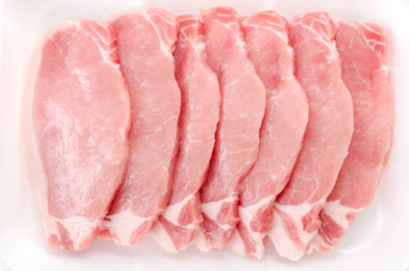 Pork meat inside tray in White background.の写真素材
