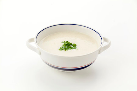 Enoki Mushroom potage soup with parsleyの写真素材