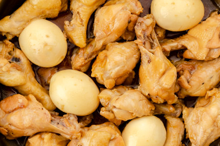 Chicken drummette and eggs simmered in sweet and spicy soy sauce.の写真素材