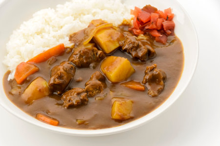 Japanese beef curry rice on a plate on white backgroundの写真素材