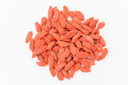 Dried goji berries on white background
