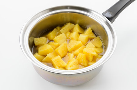 Mango soup in a pot on a white background.の写真素材